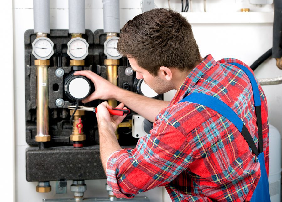 Technician servicing a boiler. 